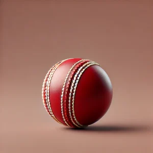 red cricket ball with white stitching